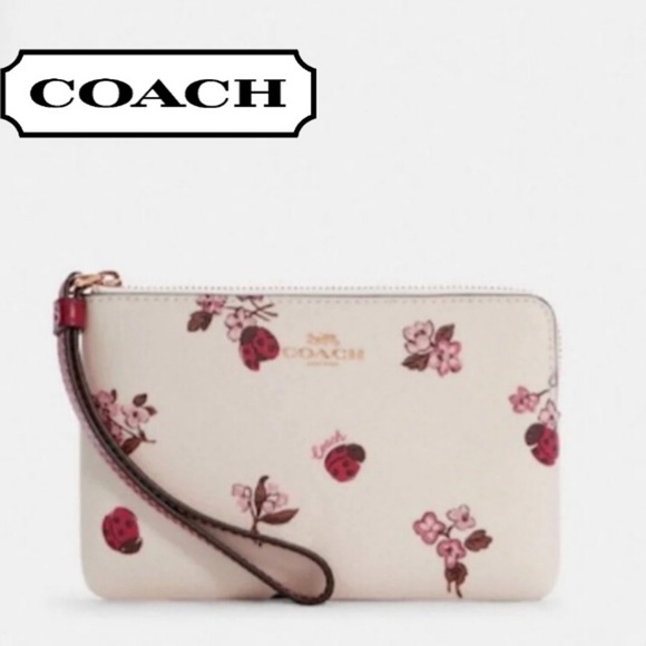 Coach Handbags - Coach Floral Ladybug Wristlet in Cream